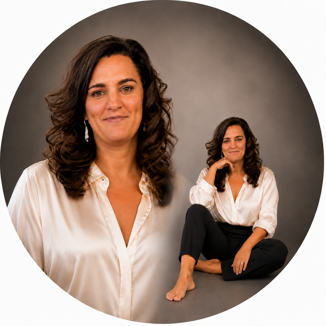 Ellie, founder of Odyssey Aura, in a studio portrait wearing a cream silk blouse